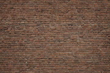 Naklejka premium A brick wall with a brown color