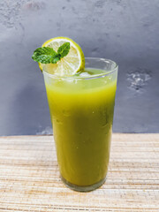 green cabbage , orange and carrot detox juice and rustic background