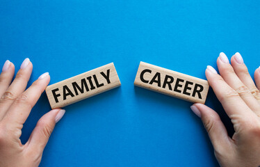Family or Career symbol. Concept word Family or Career on wooden blocks. Businessman hand....