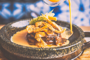 A4 wagyu Hamburg, crispy rice, burdock chips, oba tempura, tamago, special sauce