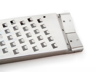 Isolated cheese grater, close up. Stainless steel handheld grater with razor blades. Grate or zest,...