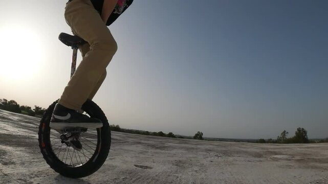 Slow motion, Sunset scenery, acrobatic agility mono-cycle achievement