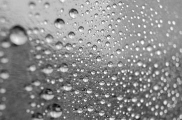 Rain water droplets on black cover background. Water droplets concept