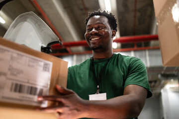 Courier loading his delivery van with packages.