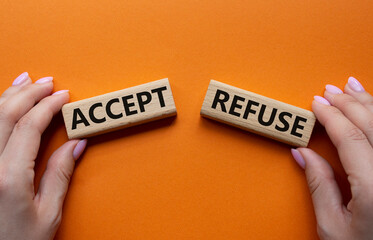 Accept or Reject symbol. Concept word Accept or Reject on wooden blocks. Businessman hand. Beautiful orange background. Business and Accept or Reject concept. Copy space