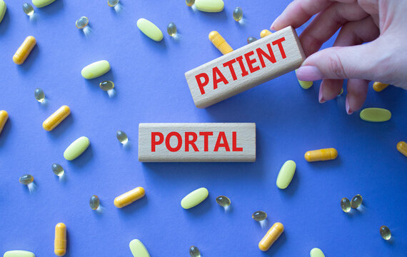 Patient Portal symbol. Concept word Patient Portal on wooden blocks. Beautiful purple background with pills. Doctor Hand. Medicine and Patient Portal concept. Copy space