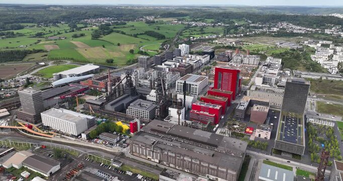 Esch Belval, old blast furnace turned into modern living urban area in Luxemburg. Aerial drone overview video
