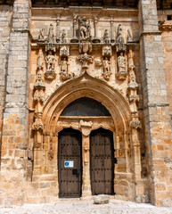 San Miguel portal of the church of Santa Maria la Real from the late 15th century in the town of Sasamon. Burgos, Castile and Leon, Spain.