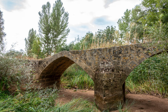Medieval bridge of Roman origin of San Miguel on the outskirts of Sasamon. Burgos, Castile and Leon, Spain.
