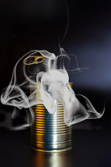 Smoke rising from an open aluminum food can