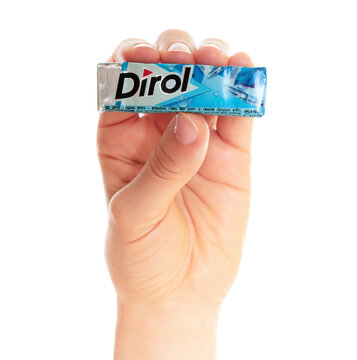 Hand holding Package of the Dirol dental gum, isolated on transparent background