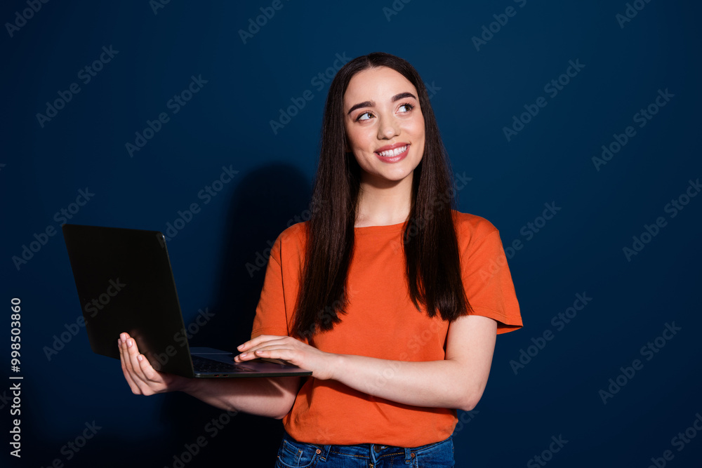 Canvas Prints Photo of pretty adorable cute woman wear stylish clothes hold wireless device look empty space isolated on dark blue color background