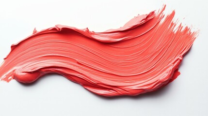 Close-up image of a smooth, thick stroke of vibrant red paint spreading on a white surface, representing artistic flair.