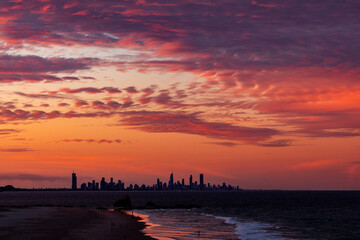 Colourful pink sky at dusk over Currumbin Rock. Gold Coast, Australia