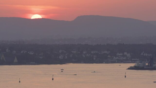 Sunset behind mountain with high angle view over Oslofjord and Bygdoy, Oslo