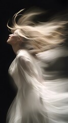 A close-up of the dancing blonde girl in white flowing fabric, her hair and swirling around like an elegant ballet on a black background