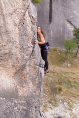 A strong woman rock climbing