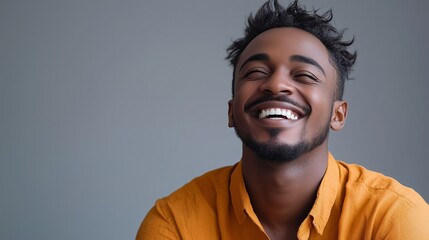 Obraz premium Portrait of a happy handsome man in a shirt with laughing