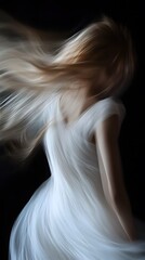 A close-up of the dancing blonde girl in white flowing fabric, her hair and swirling around like an elegant ballet on a black background