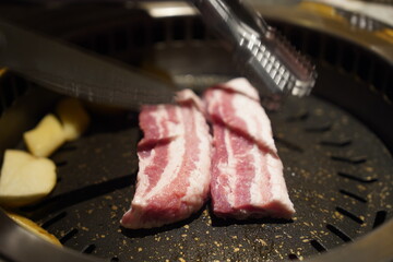 Korean pork belly, samgyeopsal cooked on the hot pan 