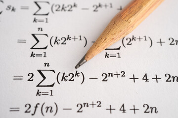 Pencil on mathematic formula exercise test paper in education school.