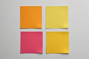 Fototapeta premium four pieces of paper are arranged in a row on a white surface