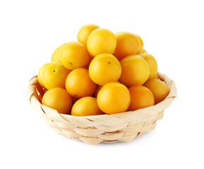 Fresh ripe yellow plums in wicker basket isolated on white