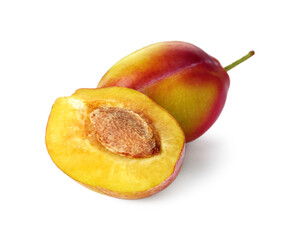 Whole and cut ripe plums isolated on white