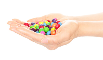 Woman hand holds lot of color candies, isolated on transparent background, fast food concept