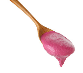 Tasty beetroot hummus in wooden spoon isolated on white