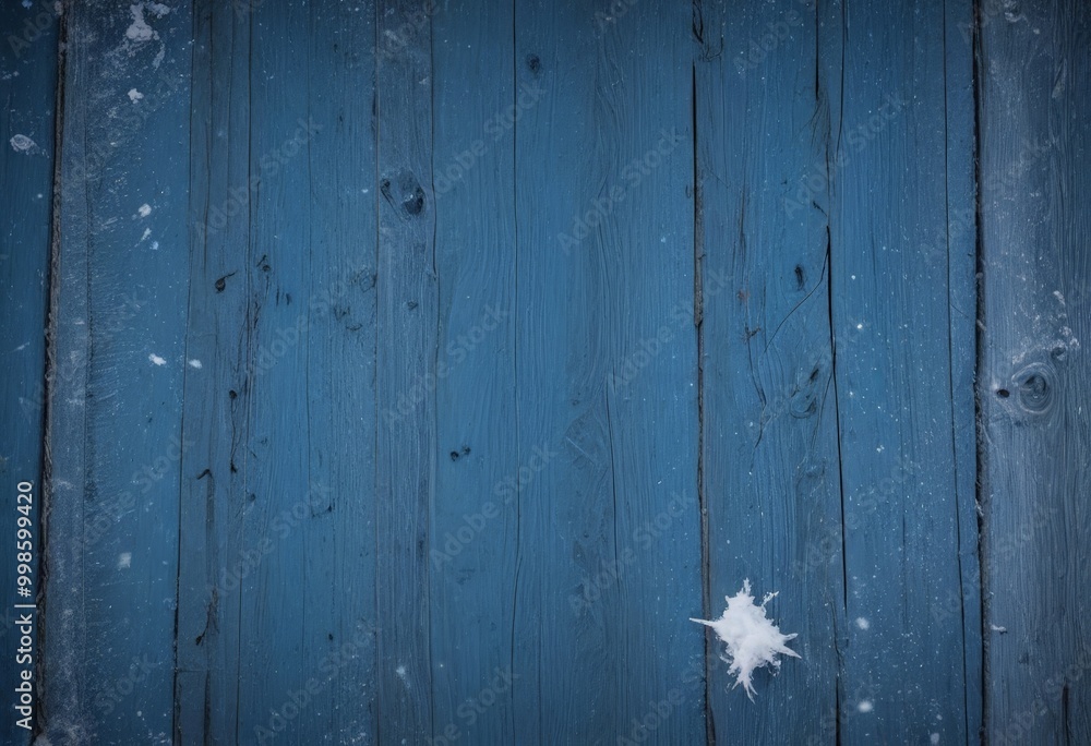 Aufkleber a close-up view blue wooden surface with a single snowflake resting on it