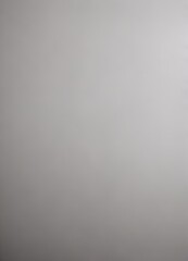 a blurred, out-of-focus photograph gray background, with no discernible text or identifiable objects