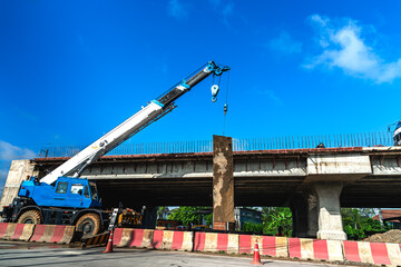 Huge crane working  in construction highway bridge and roadwork