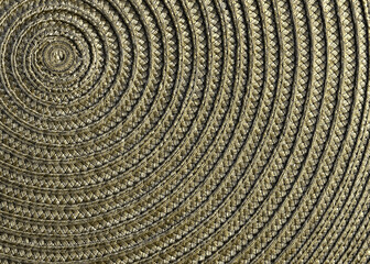 Fototapeta premium A table mat with spiral design closeup in gold