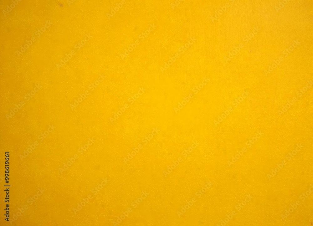 Poster a simple, unadorned yellow surface, with no discernible text or objects