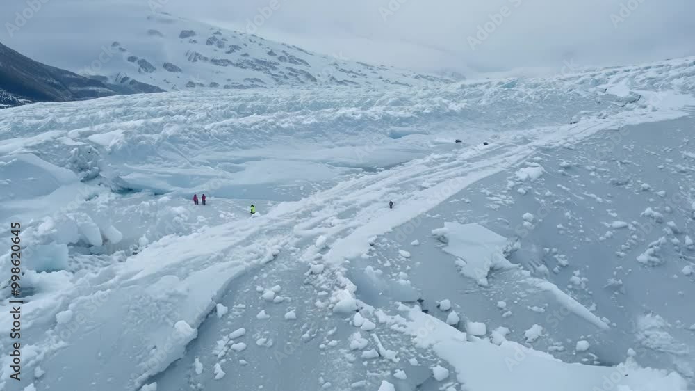 Aufkleber Scientists studying climate change on a shrinking glacier in icy polar wilderness. Capturing footage for a documentary on melting ice