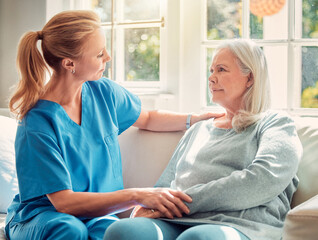Senior woman, nurse and empathy in nursing home for care, support and help on sofa. Elderly person,...