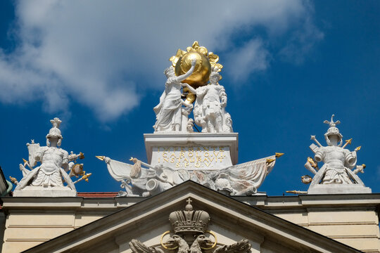 Vienna, Austria, Europe. Sculptures sit high atop a building in Vienna.