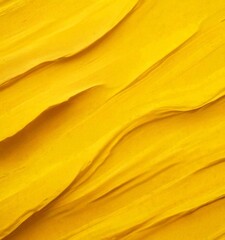 a close-up view textured surface with a yellowish-orange hue, resembling a paint stroke or a criss-cross pattern