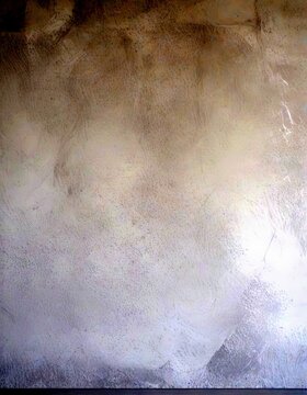a plain, gray concrete wall with a subtle texture, creating a minimalist and unadorned aesthetic