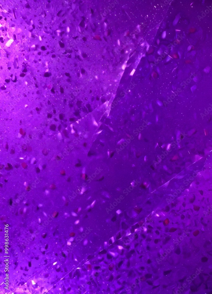 Poster a close-up view purple surface with small, irregularly shaped objects scattered across it, creating 