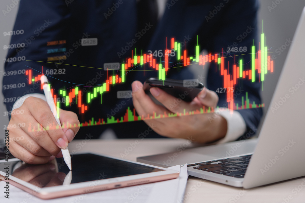 Aufkleber businessman analyzing stock market data on digital tablet with financial graph chart overlay