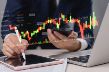 Businessman analyzing stock market data on digital tablet with financial graph chart overlay