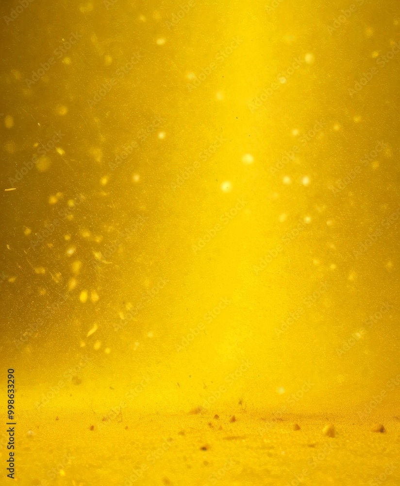 Aufkleber a close-up view yellow liquid, possibly oil or paint, with small particles floating on its surface t