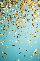 Gold confetti falling against a vibrant blue background.