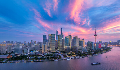 Fototapeta premium Modern city buildings skyline and river at sunset in Shanghai