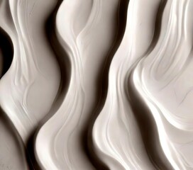 a close-up view white, wavy pattern, possibly resembling a fabric or a textured surface