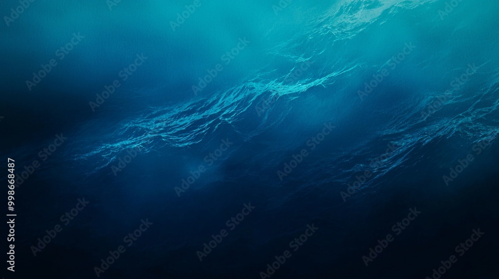 Poster rays of sunlight are filtering through the surface of the ocean, creating an ethereal underwater sce