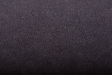 Close-up of natural craft paper texture, showcasing its earthy, raw, and eco-friendly material. Navy blue colour background.