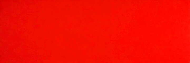 Fototapeta premium a close-up view red fabric surface, with a slight texture visible